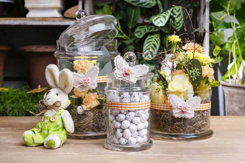 Seasonal decoration in an empty glass candle jar