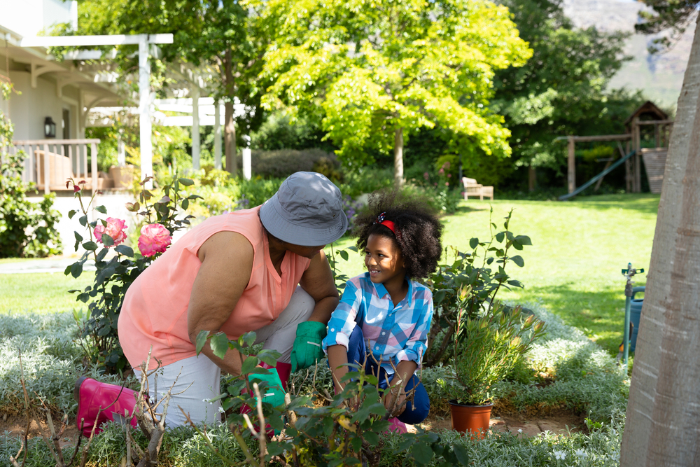 mother and daughter starting a garden with kids